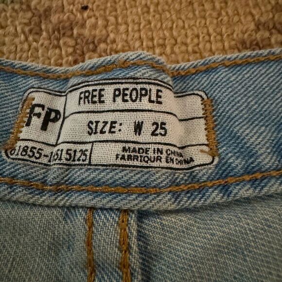 Free People distressed medium wash denim button fly cuffed shorts. 25 - Picture 5 of 12